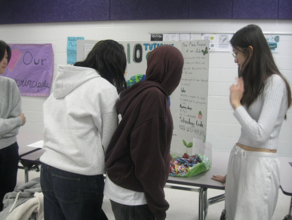  Rising eighth graders explore the Bio Tutoring club and the high expectations that often come with high school opportunities during the Activity Fair on Apr. 10, 2025.
Photo by Athula Cheboli